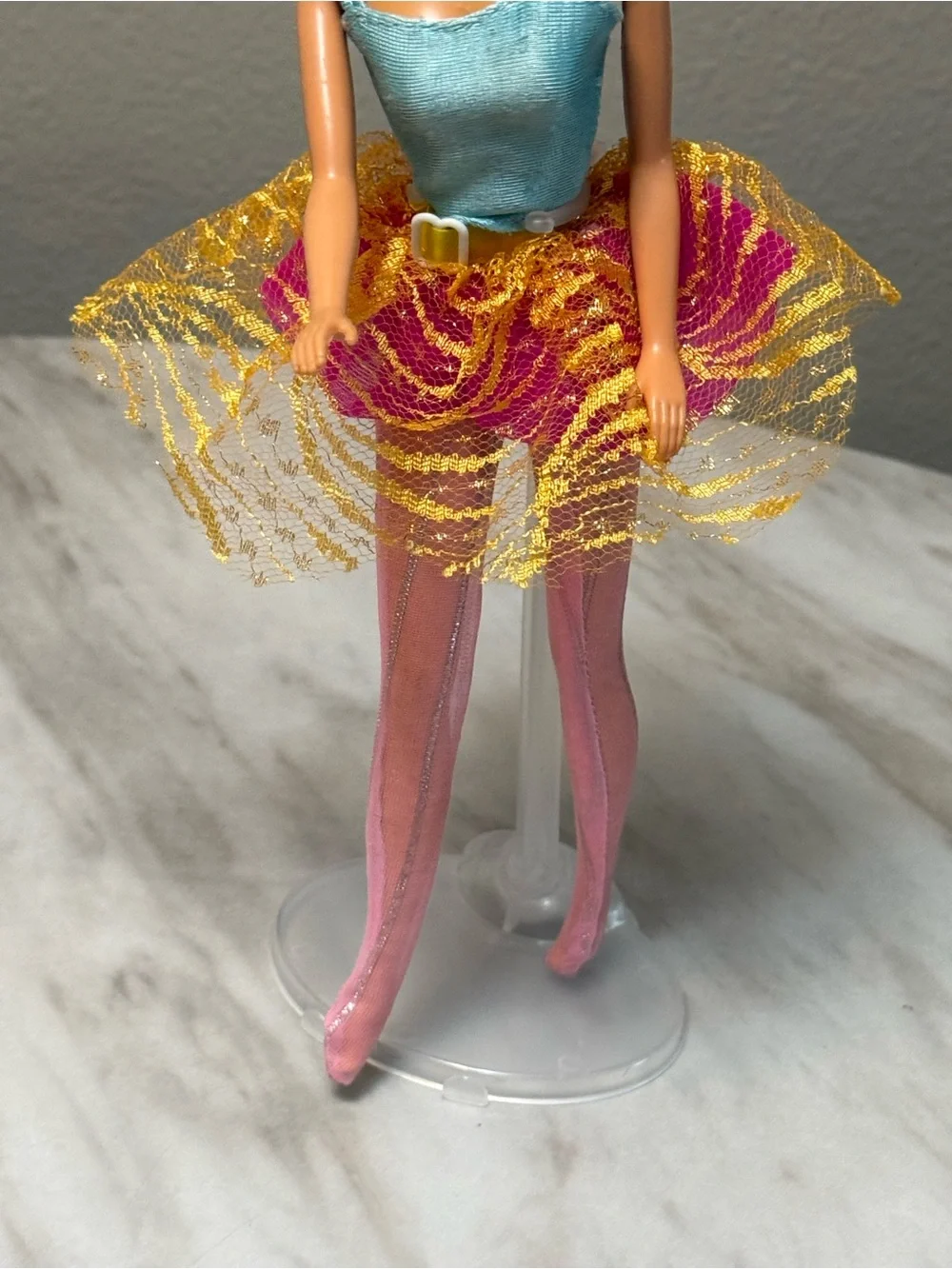 vintage blonde 1998 Bubble Fairy Barbie doll wearing a light blue top and a pink